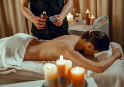 alternative-beauty-salon-therapist-preparing-warm-herb-infused-oil-female-back-massage_362389-6463